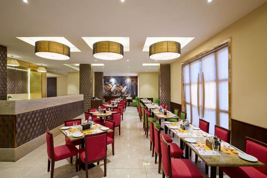 Ahaan Restaurant interior with elegant dining tables, warm lighting, and modern decor in Rameswaram